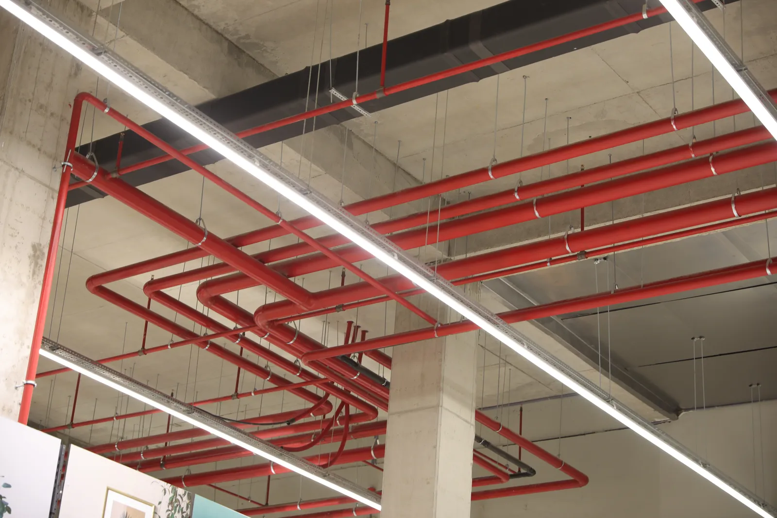 Red fire protection pipes on ceiling